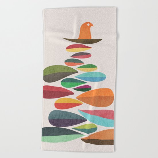 Bird nesting on top of pebbles hill Beach Towel