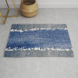 Denim frame. Ripped denim fabric with fringe edge on bleached denim background, text place, copy space. Worn Jeans Casual Double Color patch. Classic blue denim pattern texture  Rug