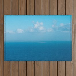 boat on ocean with blue sky and clouds - landscape photography Outdoor Rug