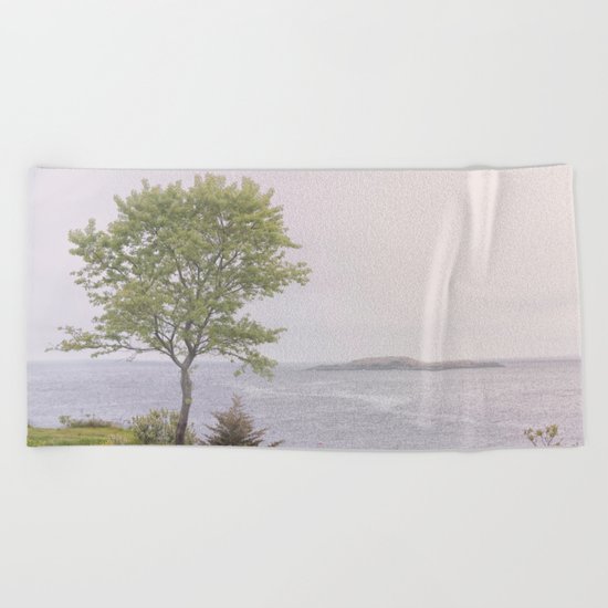 Lone tree by the sea Beach Towel