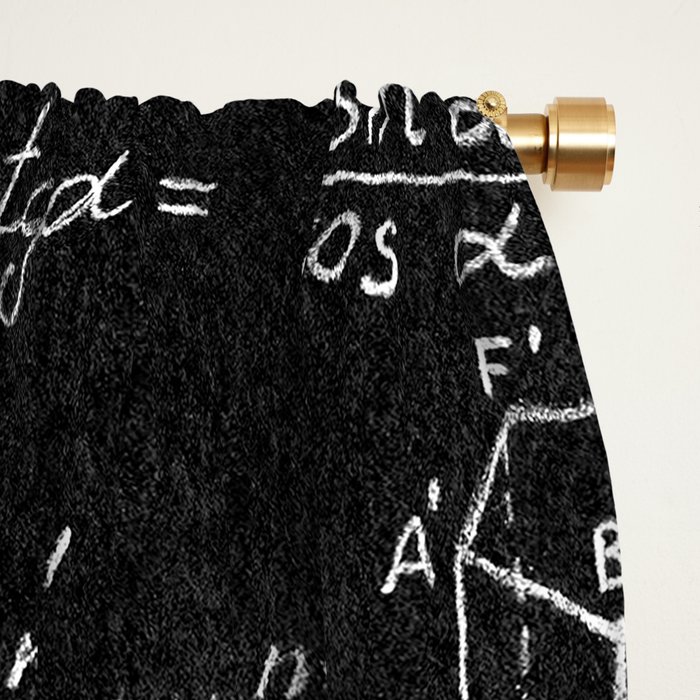 Blackboard inscribed with scientific formulas and calculations in physics and mathematics. Science and education background.