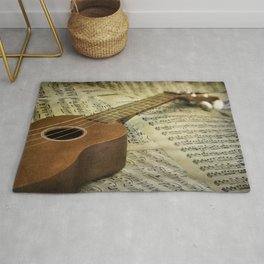 Do a Little Jig; ukulele with sheet music in the background Area & Throw Rug