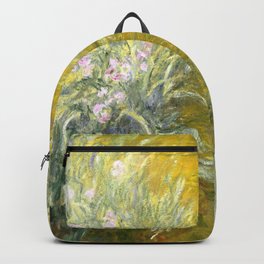 The Path through the Irises floral iris landscape painting by Claude Monet in alternate yellow Backpack