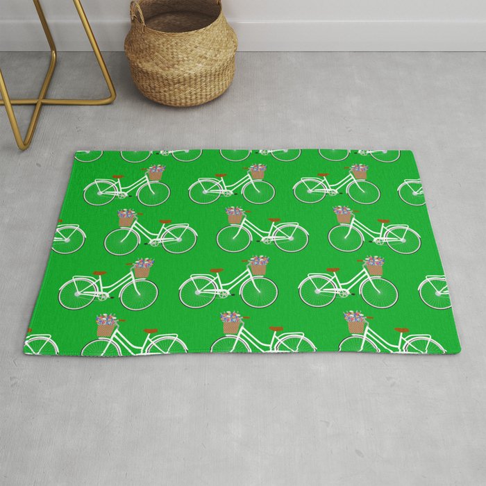 Bicycle with flower basket on green Rug