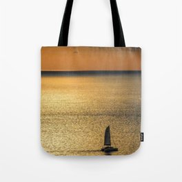 Sunset view of calm ocean Tote Bag