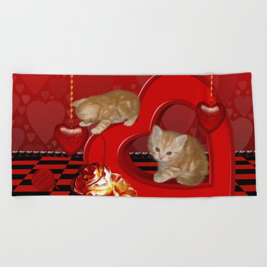 Cute, playing kitten Beach Towel
