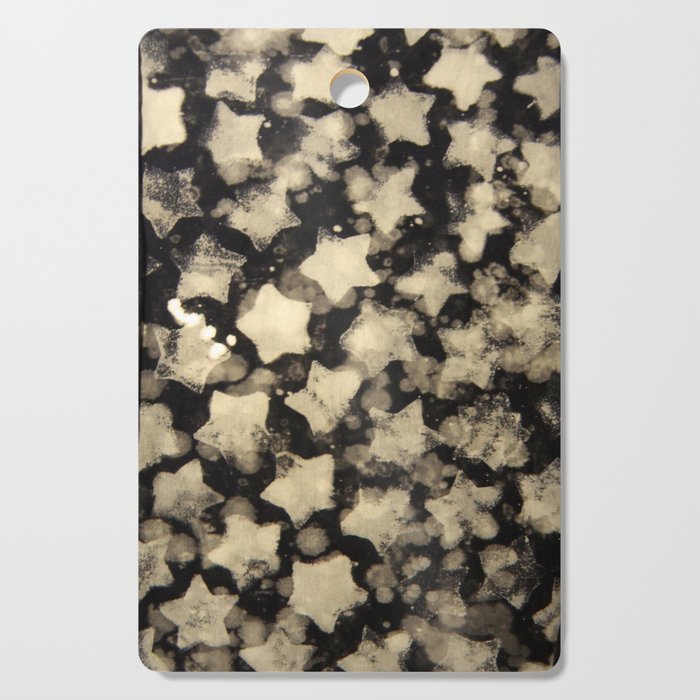 Bleached Distressed Stars on a Black Background Cutting Board
