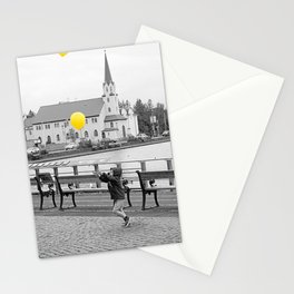 Boy releasing yellow balloons into the sky | Reykjavik, Iceland Stationery Card