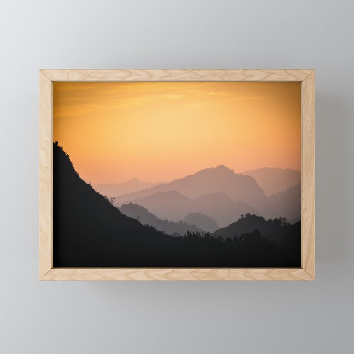 mountains at dusk Framed Mini Art Print