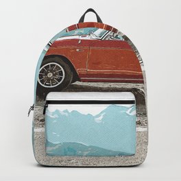 Red Sedan On Gray Sand During Daytime Backpack