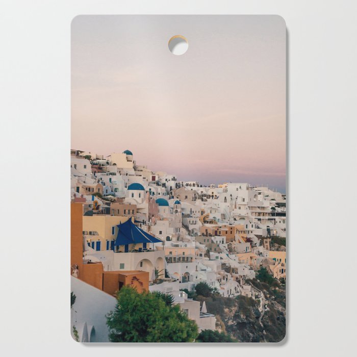Sunset over Oia, Santorini | White houses, pink sky and golden hour | Travel photography in Greece Cutting Board