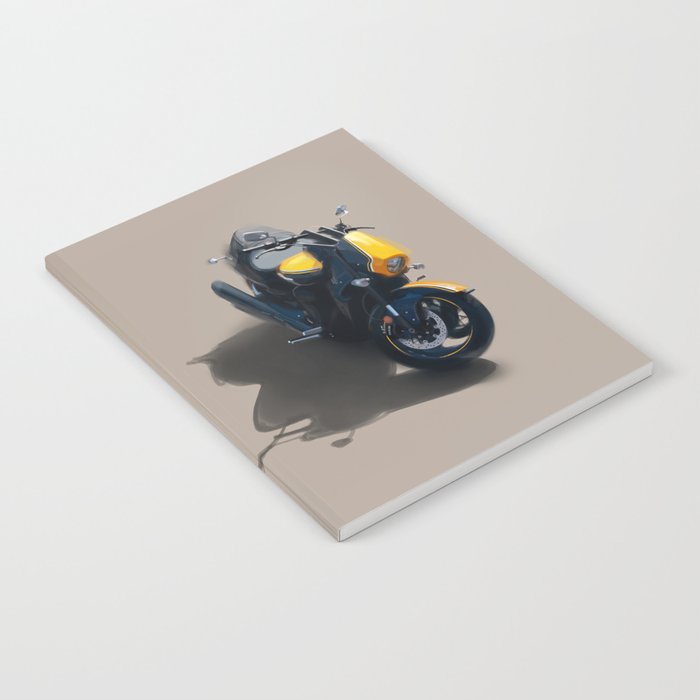  A modern, bright yellow and black motorcycle parked outside on a sunny day Notebook
