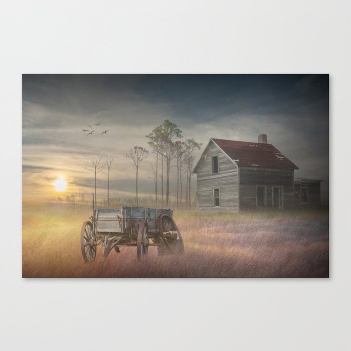 Old Wooden Wagon with Abandoned Farm House in the Morning Mist at Sunrise Canvas Print