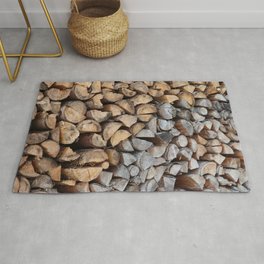 Old and new stacked firewood Rug