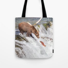 Grizzly bear face to face with salmon Tote Bag