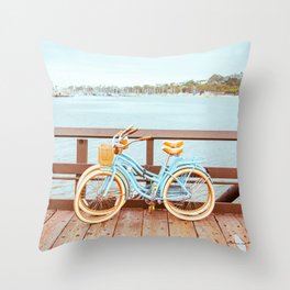 Two retro bicycles standing on Santa Barbara pier, California, USA. Vintage filter with muted teal blue and orange colors. Throw Pillow