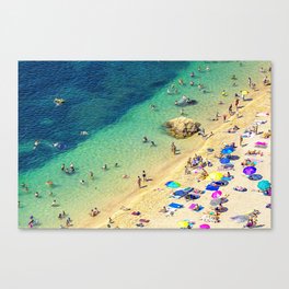 Beach umbrellas and bathers in French Riviera Canvas Print