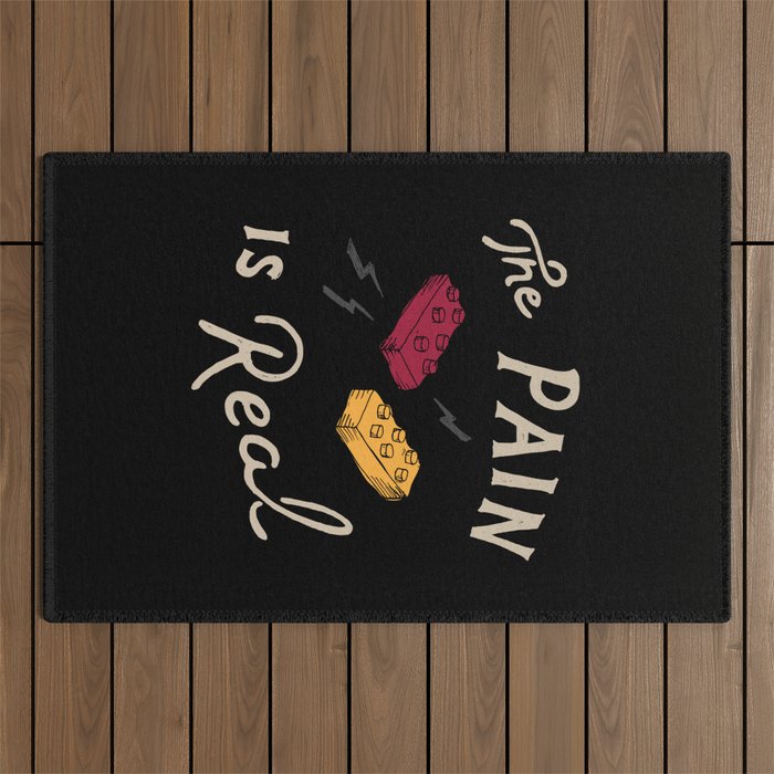 Real Pain Outdoor Rug