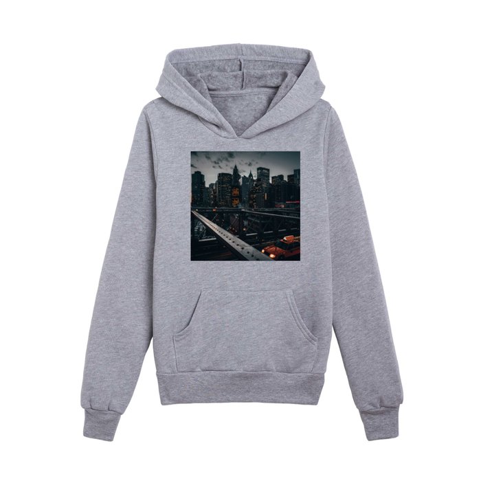 New York City Manhattan Skyline and Brooklyn Bridge with a yellow taxi at sunset Kids Pullover Hoodie