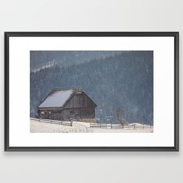 Winter landscape with an old house in a village Framed Art Print