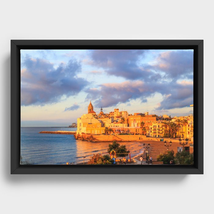 View of Sitges, Spain basking in the early morning sunshine Framed Canvas