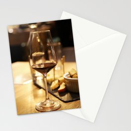 Glass of red wine on a table Stationery Card
