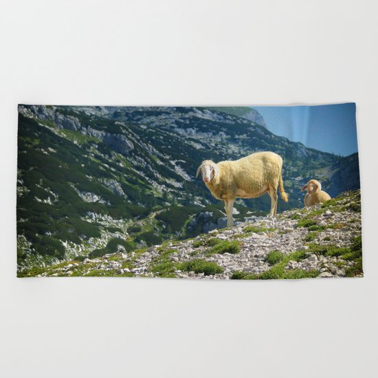 Sheep on the hill Beach Towel
