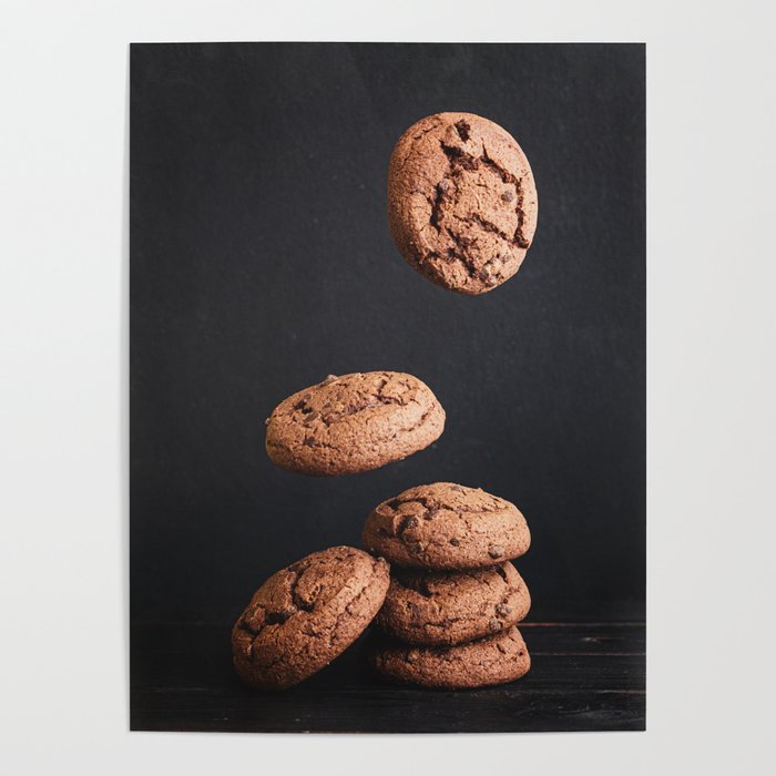 Delicious fresh chocolate cookies stacked on a wooden table Poster