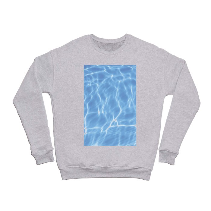 Blue ripped water in swimming pool background Crewneck Sweatshirt