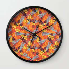 Leave Silhouettes blue, orange, yellow on red Wall Clock