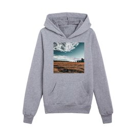 Grass field on sunny day with blue sky in the village and forest   Kids Pullover Hoodies