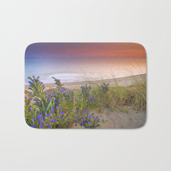 "Purple flowers at the sea sunset" Bath Mat