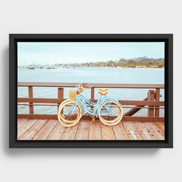Two retro bicycles standing on Santa Barbara pier, California, USA. Vintage filter with muted teal blue and orange colors. Framed Canvas