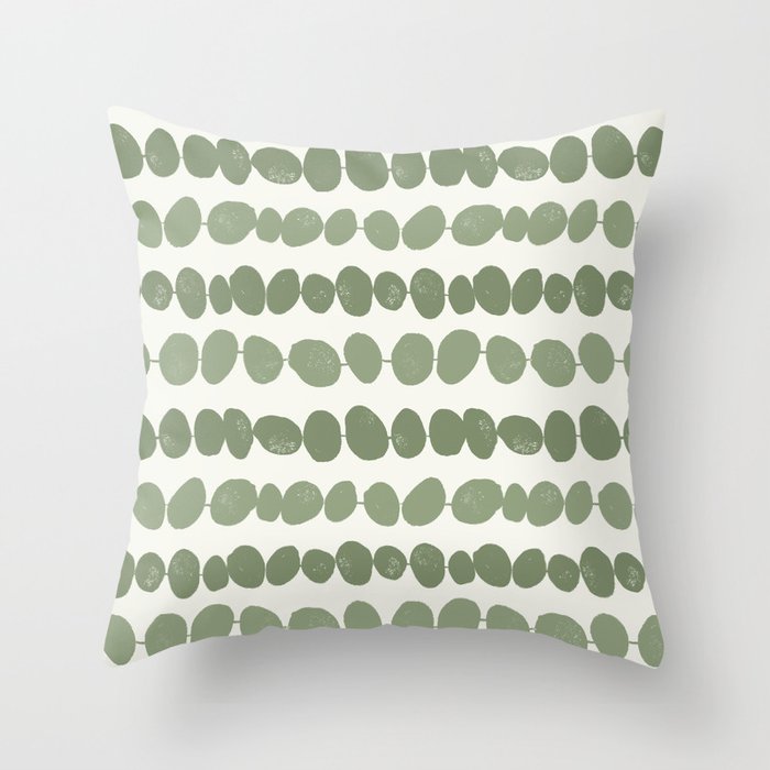 Pebbles - green pebbles on a string with a cream background Throw Pillow