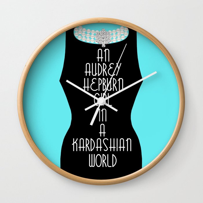 An Audrey Hepburn girl in a Kardashian world (in blue) Wall Clock