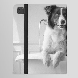 Border collie dog in a bear foot vintage bathtub black and white photograph - photography - photographs iPad Folio Case