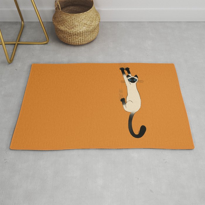 Siamese Cat Hanging On Rug