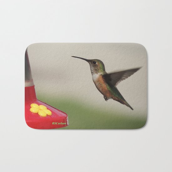 Ms. Hummingbird Checks the Feeder Bath Mat