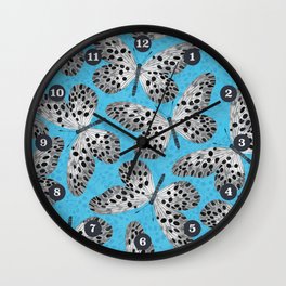 Black and white butterflies on blue background Wall Clock