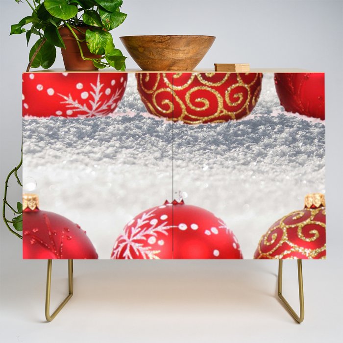 Red and Gold Christmas Ornaments In The Snow  Credenza