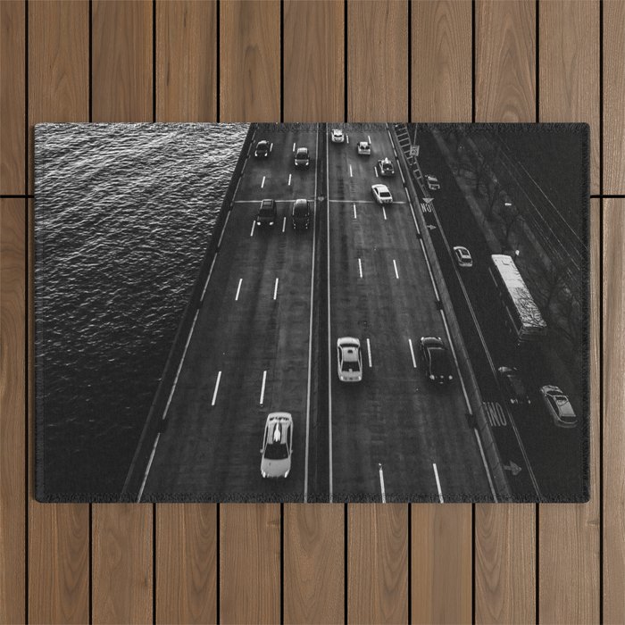 Car traffic below Manhattan Bridge in New York City black and white Outdoor Rug