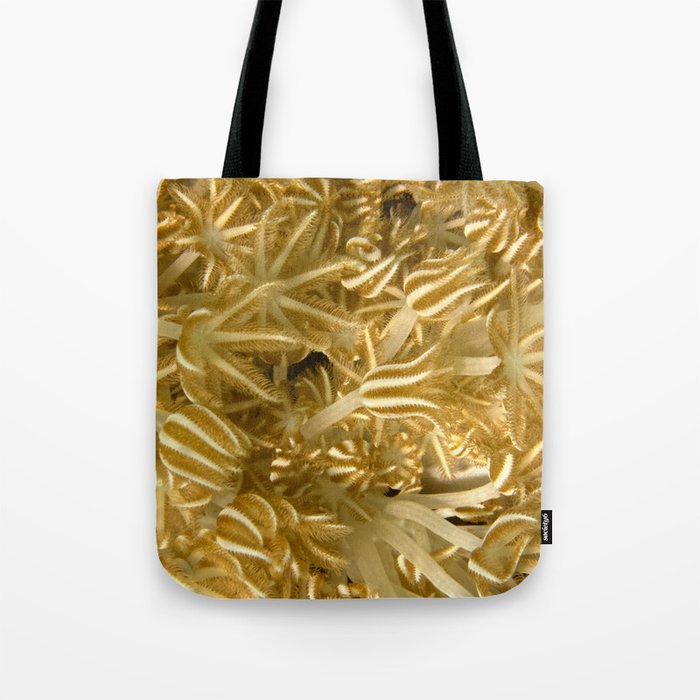 Grasping (in gold) Tote Bag