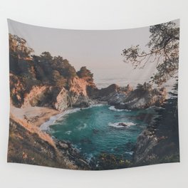 sunset on blue ocean cove with waterfall Wall Tapestry