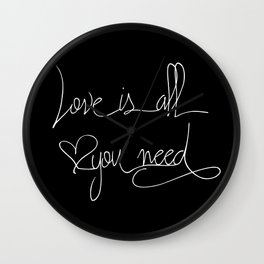 Love is all you need white hand lettering on black Wall Clock