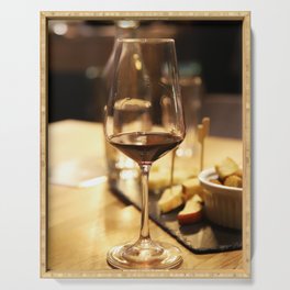 Glass of red wine on a table Serving Tray