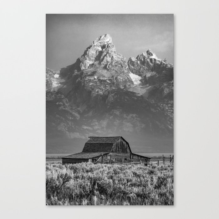 Towering Mountain Peaks Of Grand Tetons And Mormon Row Barn - Black and White Canvas Print