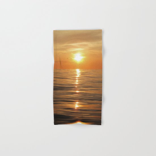 Sun setting over calm waters Hand & Bath Towel