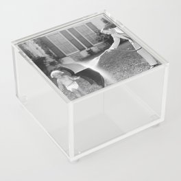 Always look on the bright side of life; little girl thwarting father with hose using umbrella humorous funny black and white photograph - photography - photograph Acrylic Box