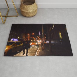 Man Running in the Street for a Taxi Rug