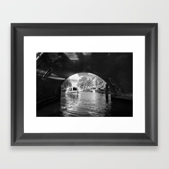 Tourboat about to go under a bridge on Amsterdam canal Framed Art Print